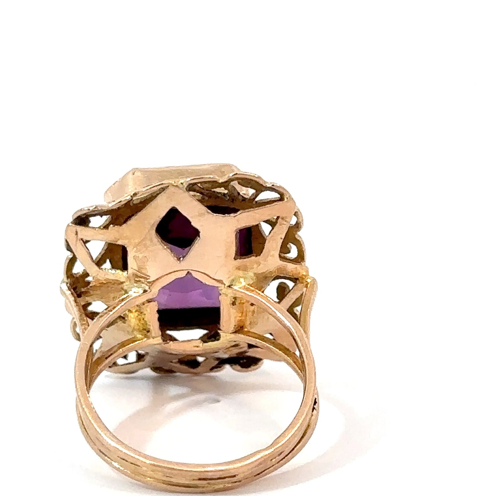 Back view of an 18k yellow gold amethyst ring from John's Loan & Jewelry, detailing the ring's shank and the filigree beneath the rectangular amethyst.
