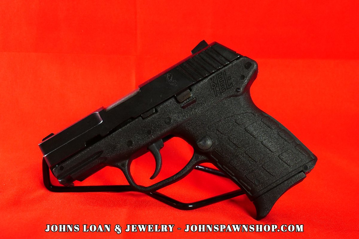 Detailed image of a KelTec PF-9 semi-auto firearm, on display at John's Loan & Jewelry, highlighting the textured polymer frame designed for concealed carry.
