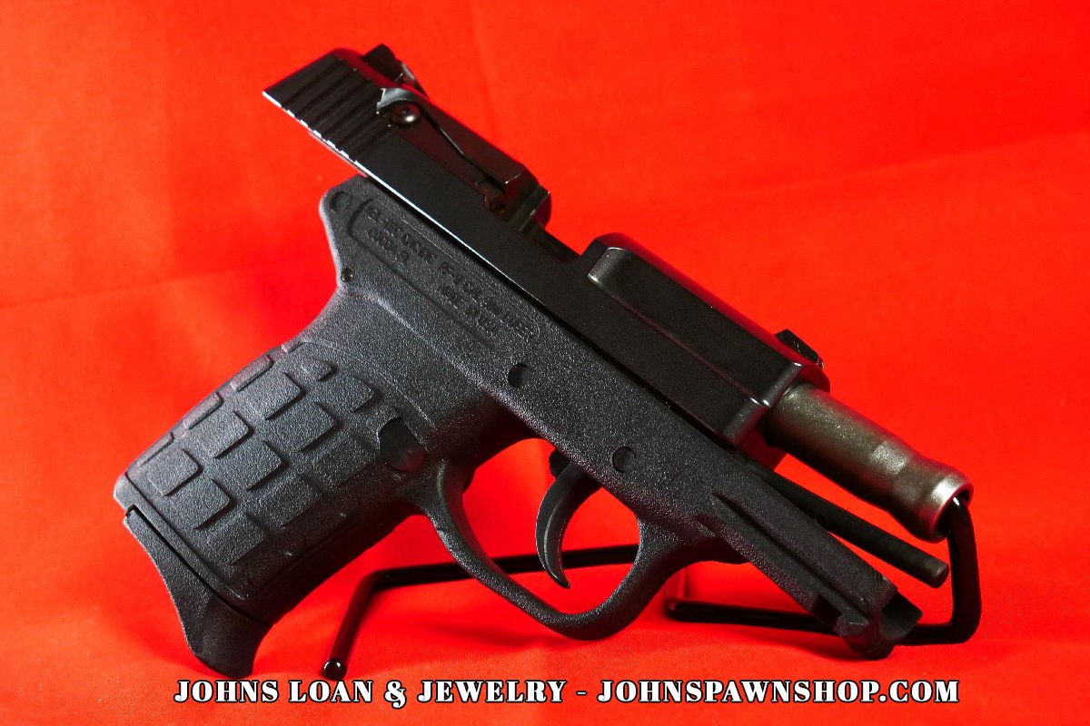 Side-profile view of a KelTec PF-9 firearm from John's Loan & Jewelry, highlighting the black textured polymer frame and DAO trigger mechanism, optimal for semi-auto concealment.