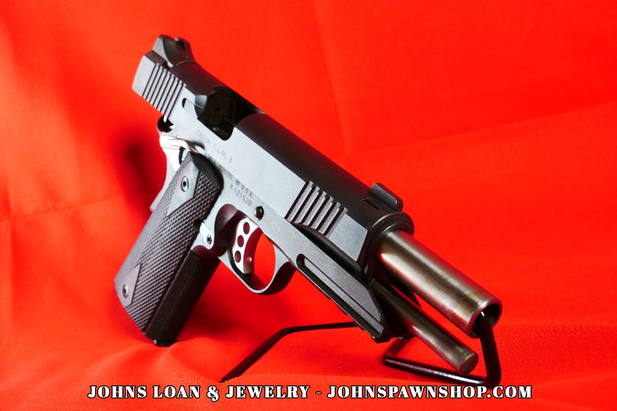 Kimber Custom TLE/RL II .45 ACP pistol highlighting the accessory rail for lights/lasers, preferred by LAPD and John Wick fans, displayed at John's Loan & Jewelry.