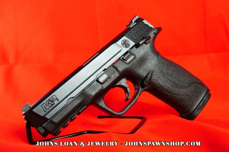 Smith & Wesson Military & Police 9mm semi-auto pistol in excellent shape, showcasing the firearm's sleek design. Available at John's Loan & Jewelry, your Las Vegas pawn shop.