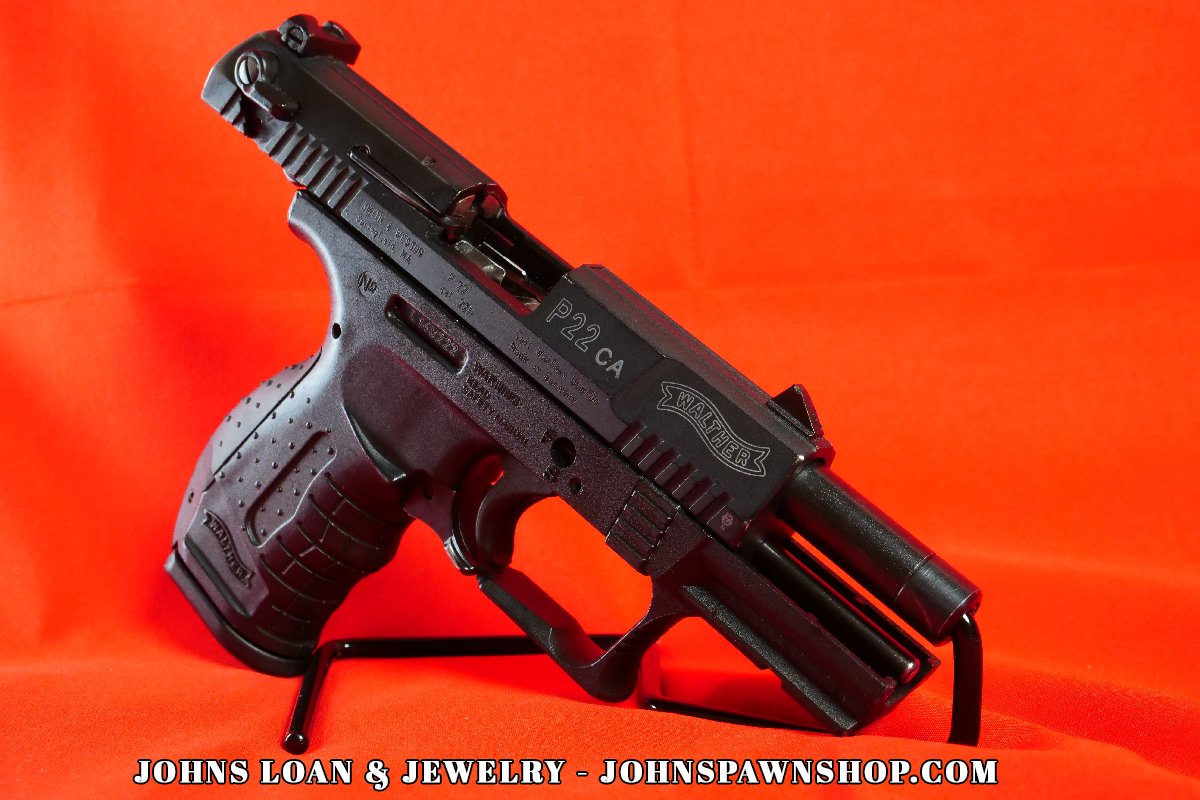 Profile view of the Walther P22 pistol with an open slide, showing the barrel and internal mechanisms, available at John's Loan & Jewelry; ideal for casual target practice and new shooters.