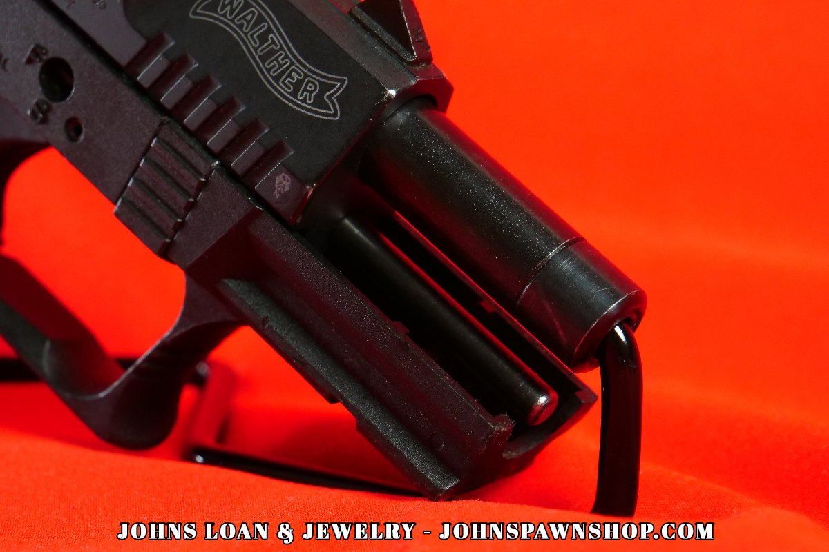 Detailed close-up of the Walther P22 .22LR pistol barrel and frame; a reliable firearm available through John's Loan & Jewelry, perfect for low-recoil semi-auto pistol training.
