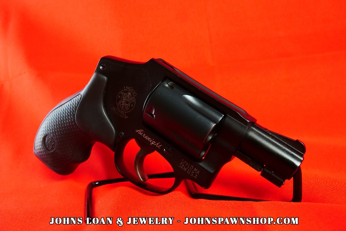 Side view of the Smith & Wesson 442-1 J Frame .38 Special revolver, highlighting the 'Airweight' inscription and textured grip, offered by John's Loan & Jewelry for concealed carry enthusiasts.