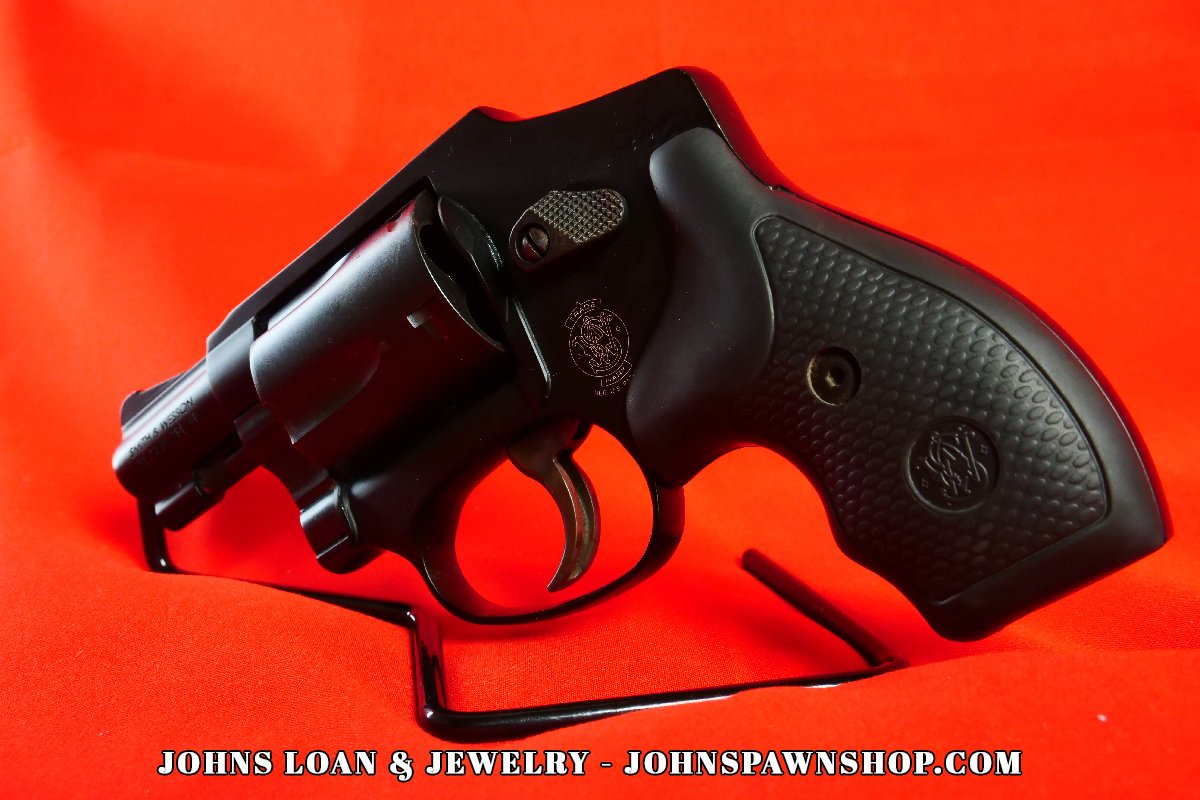 Angled view of the Smith & Wesson 442-1 J Frame .38 Special revolver, featuring the firearm's textured grip, frame details, and compact design, sold at John's Loan & Jewelry, Las Vegas Pawn Shop.