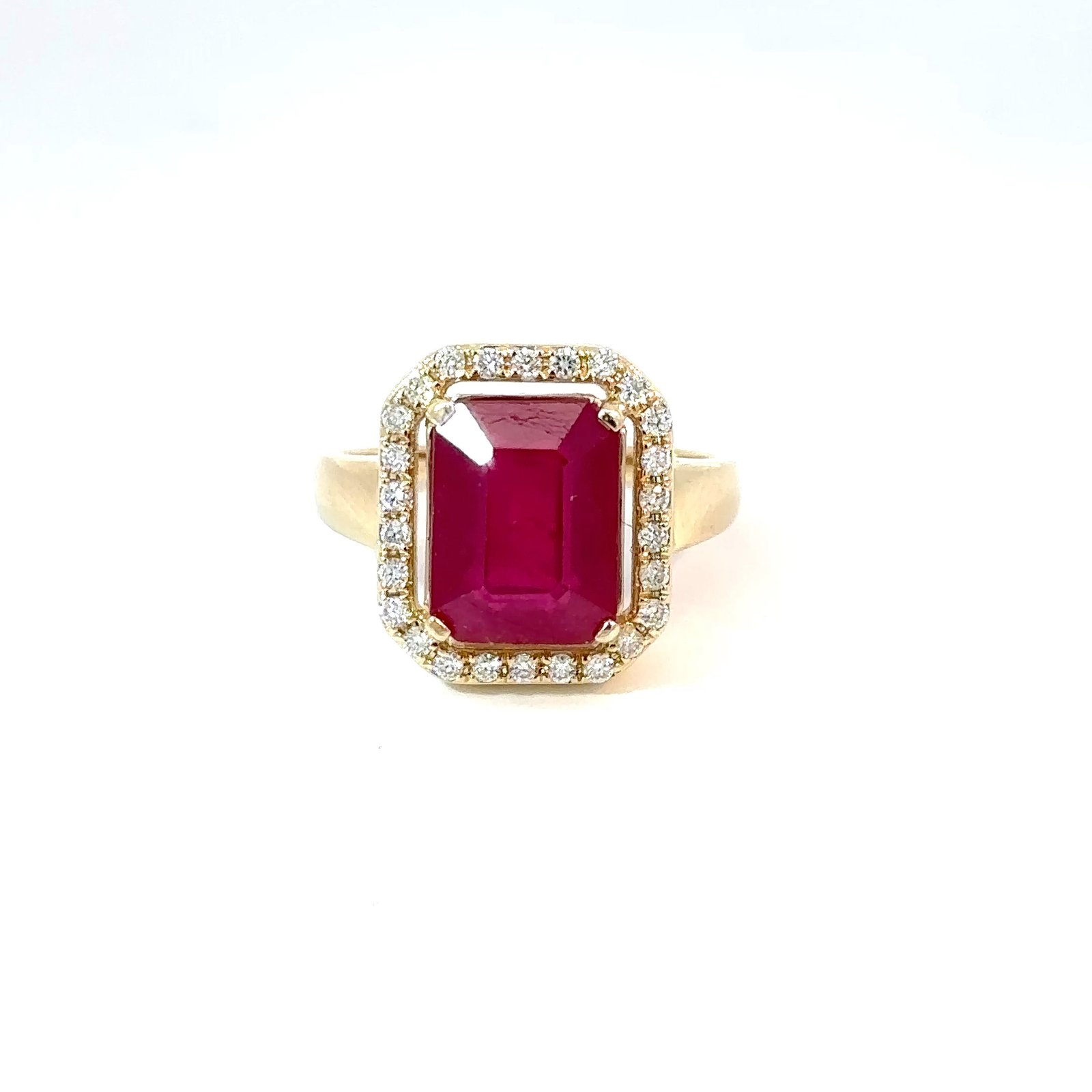 Front-facing view of John's Loan & Jewelry's 14k yellow gold ring, featuring a rectangular ruby solitaire enclosed by a halo of round-cut diamond accents.