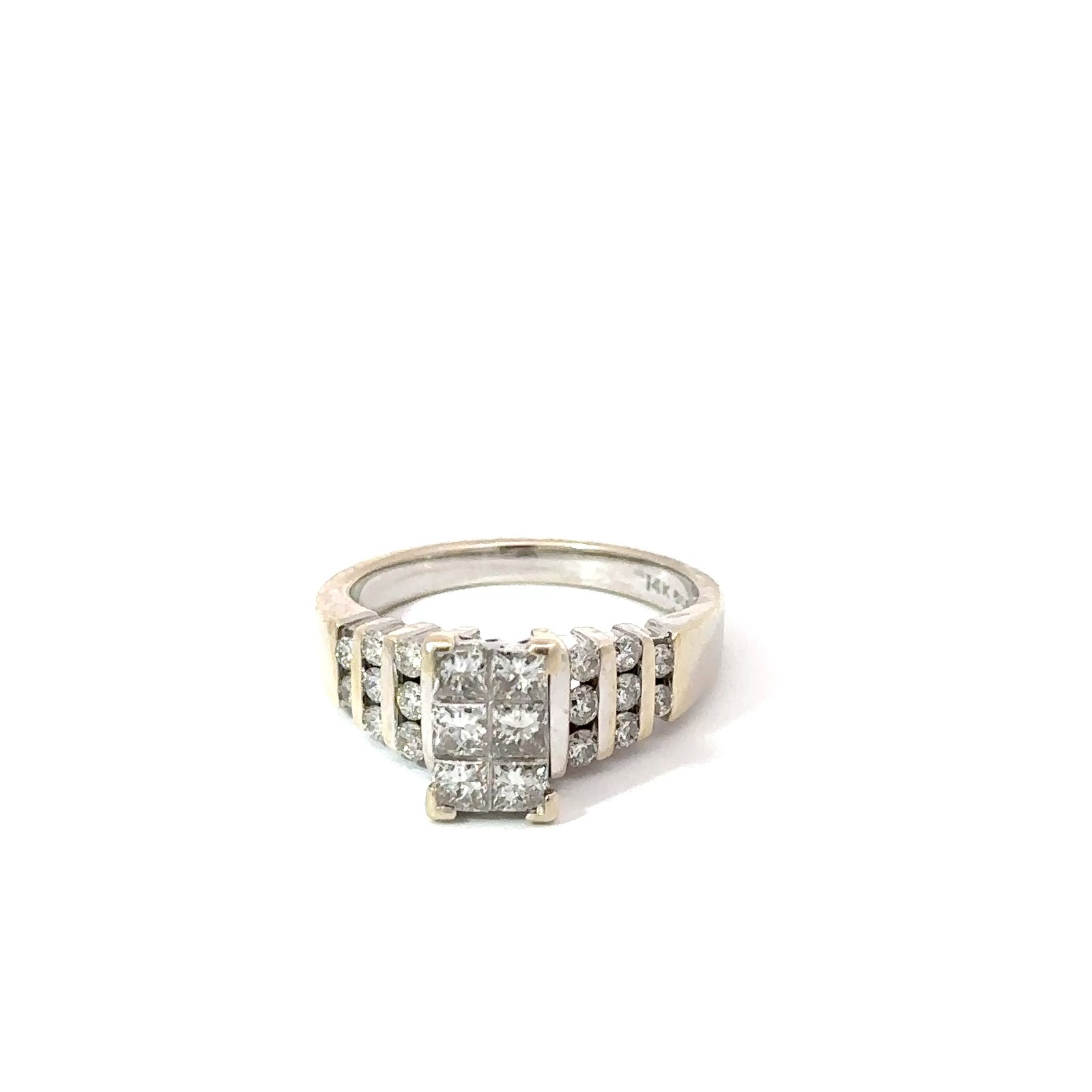 Front-facing view of John's Loan & Jewelry 14K white gold ladies ring, featuring a princess-cut diamond table in a six-channel setting, showcasing the jewelry's gold composition.