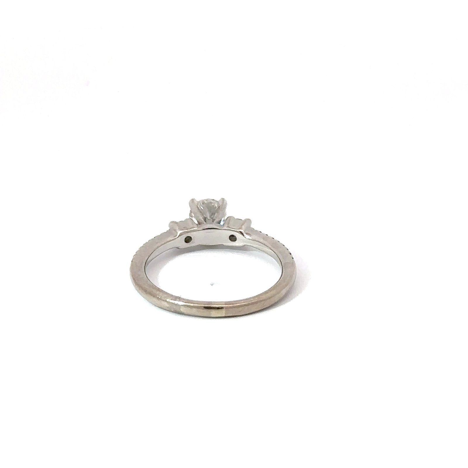 Back view of a ladies' white gold engagement ring from John's Loan & Jewelry, showing the band detail and the setting beneath the .4ct center diamond.
