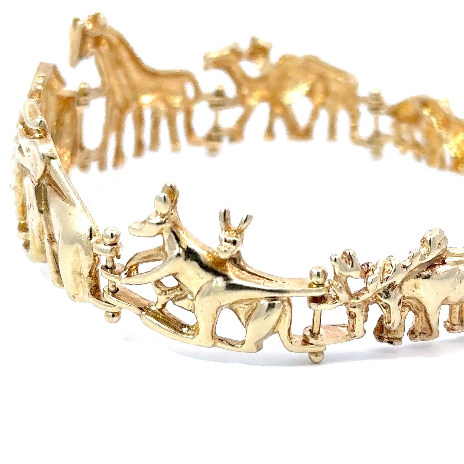 John's Loan & Jewelry 14k gold Noah's Ark bracelet displaying a collection of animal motifs. The jewelry piece features kangaroos and horses on a white background.