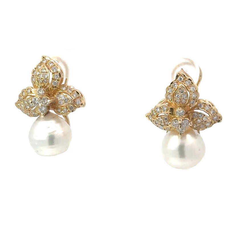 Stunning 14k yellow gold earrings featuring a pair of white pearls and diamond accents, available from John's Loan & Jewelry Co.