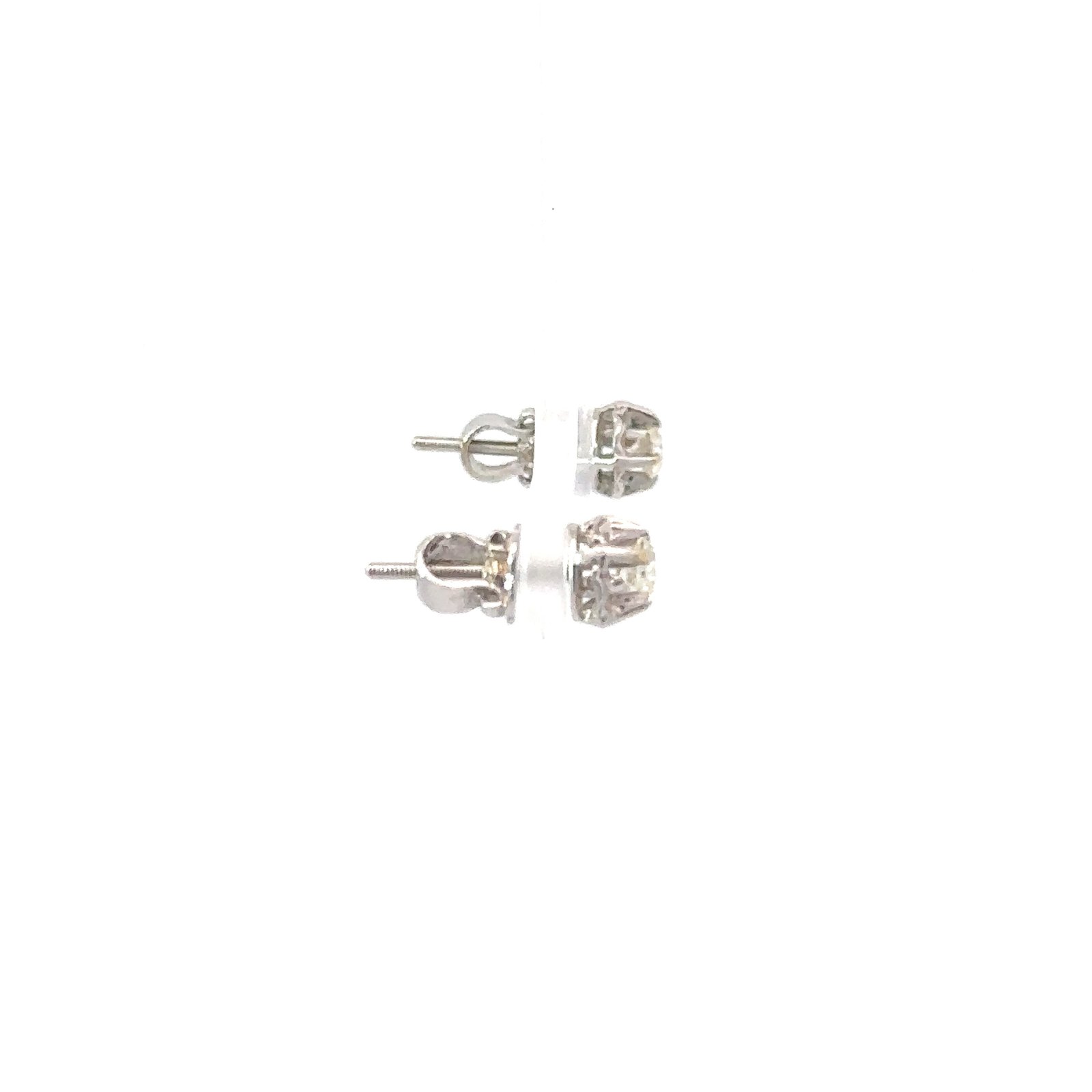 Angled shot of John's Loan & Jewelry 18kt white gold .2ct diamond stud earrings; showcasing the jewelry's profile and earring backing.