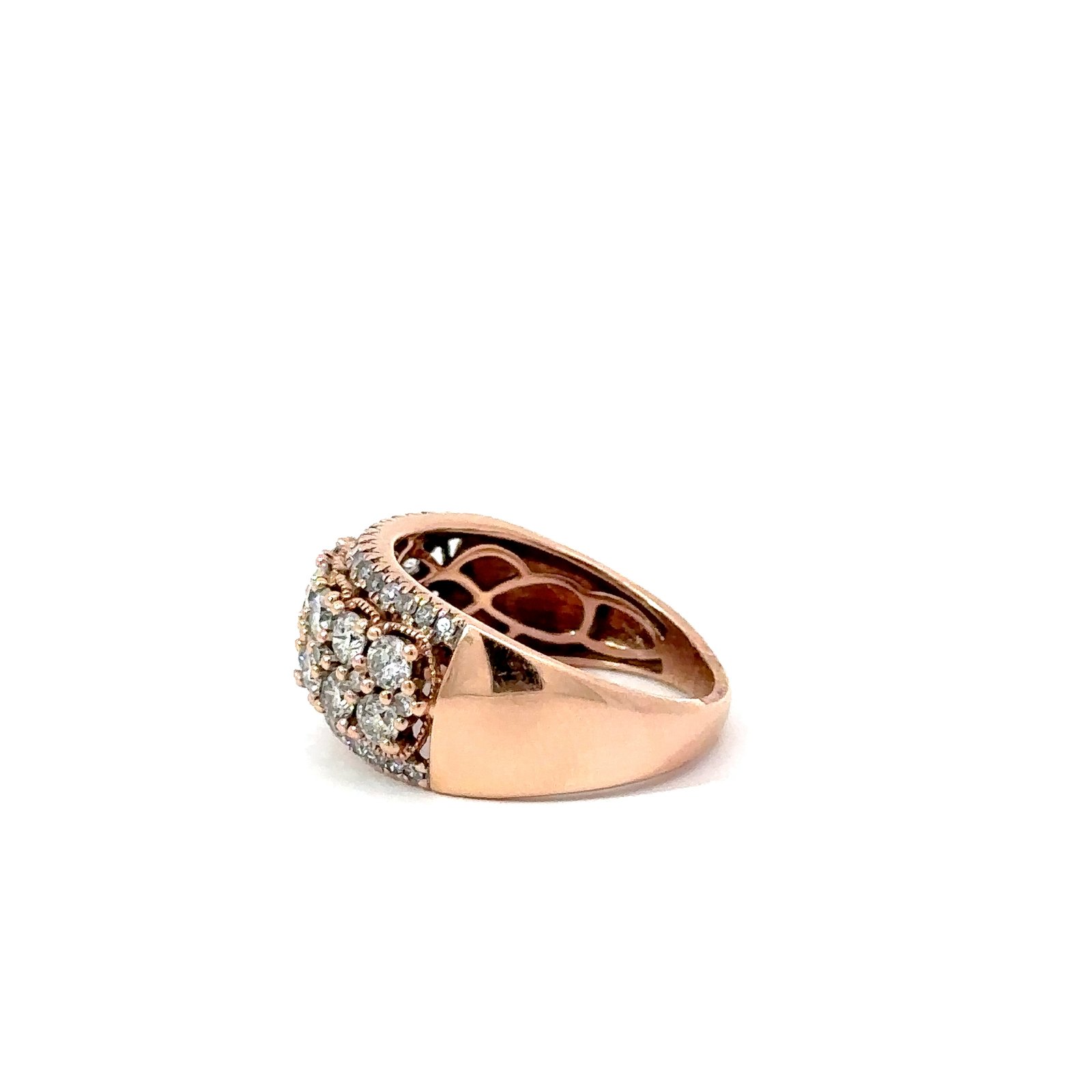 Side view of a 14k rose gold diamond cluster ring from John's Loan & Jewelry, showcasing pavé-set diamonds and the ring's curved profile.