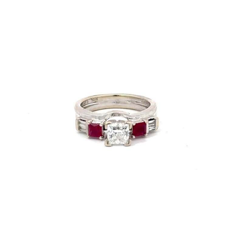 Front-facing view of a John's Loan & Jewelry 14kt white gold engagement ring featuring a princess cut diamond, flanked by channel-set ruby accents on the ring's table.