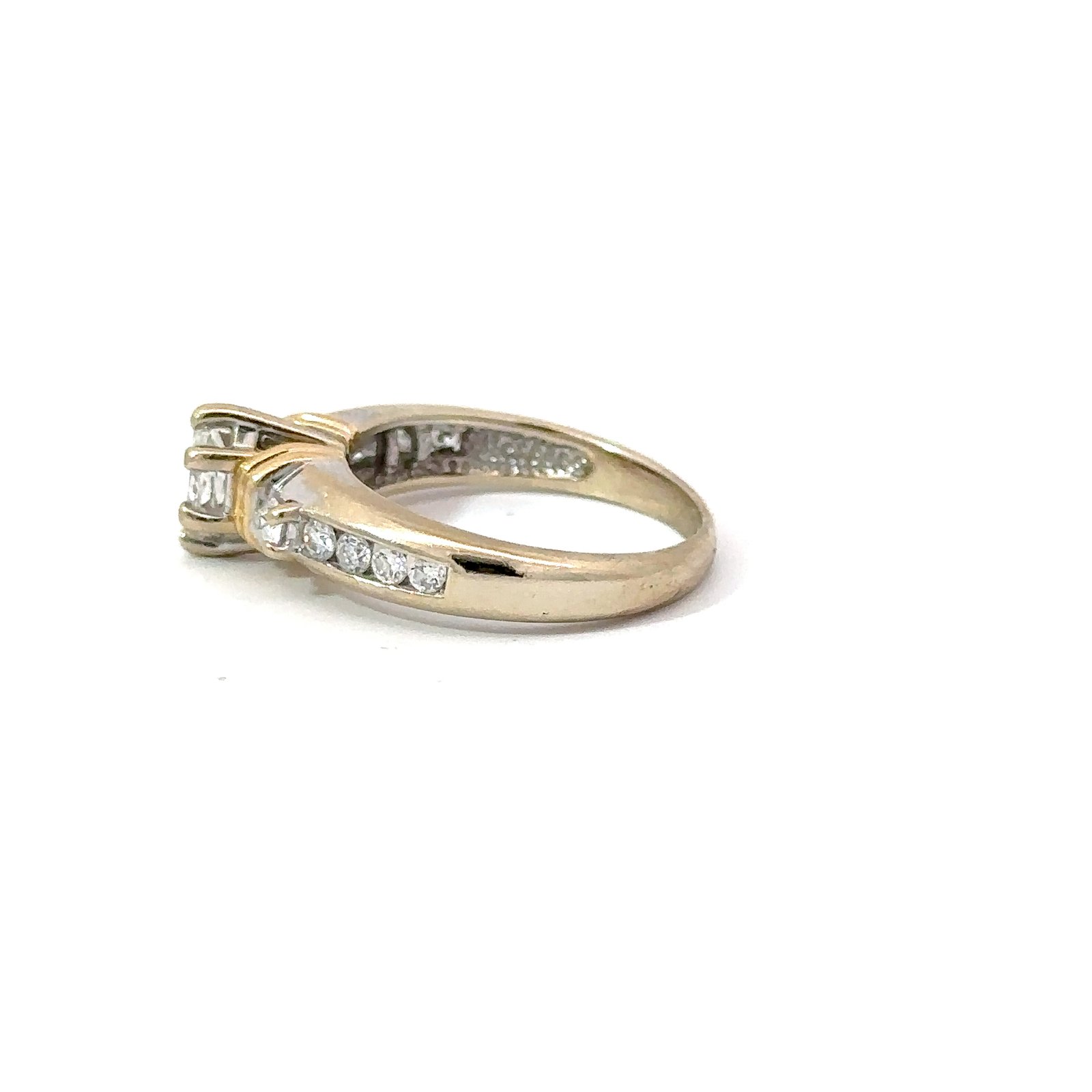 Side-profile view of the 14kt gold marquise diamond engagement ring from John's Loan & Jewelry, highlighting the channel-set diamond detailing along the ring shank and the setting's construction.